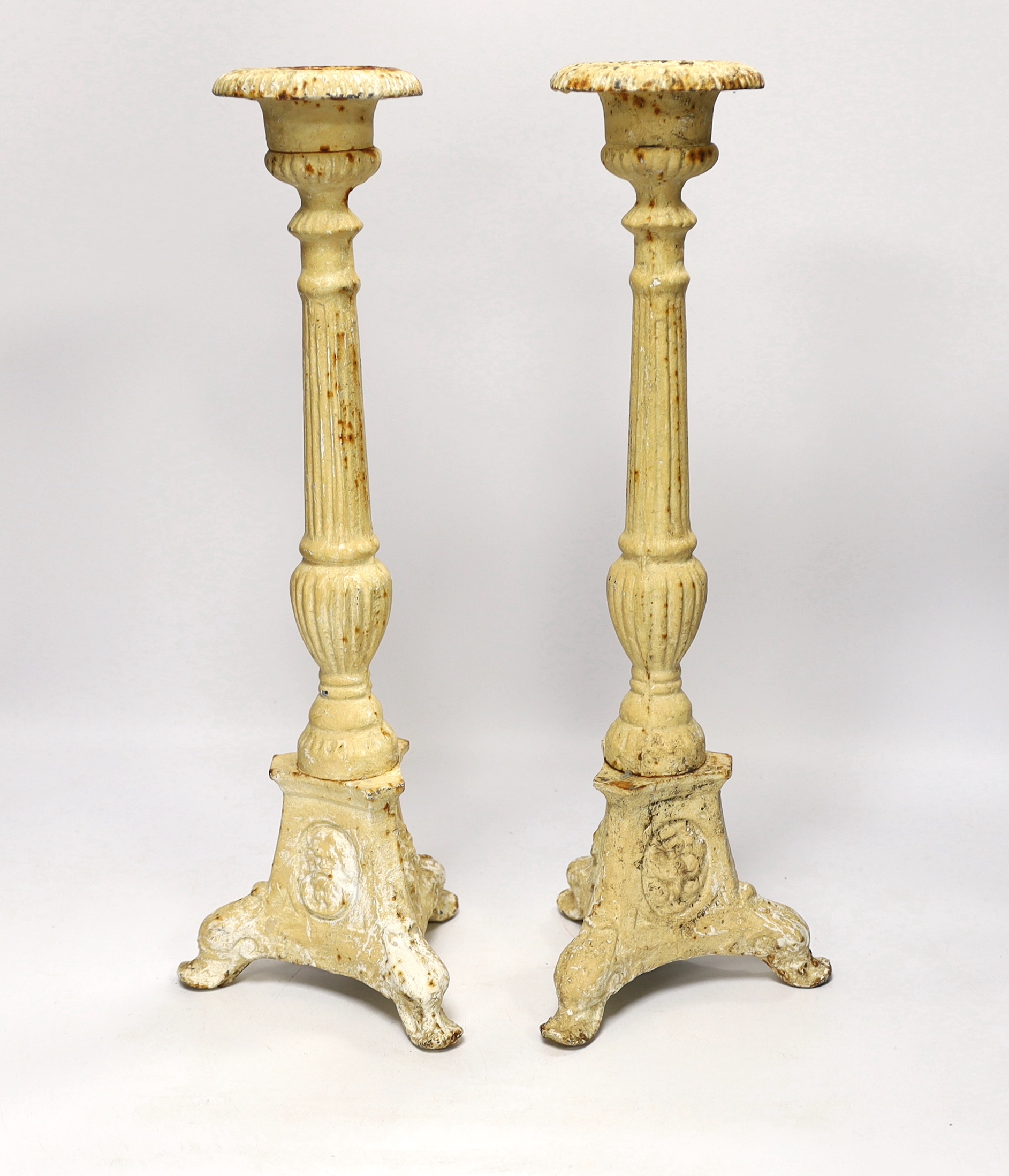 A pair of period-style cast iron candlesticks, 43cm